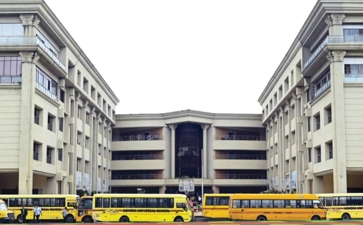 Ashoka Universal School campus on Ashoka Marg, Nashik, with school buses